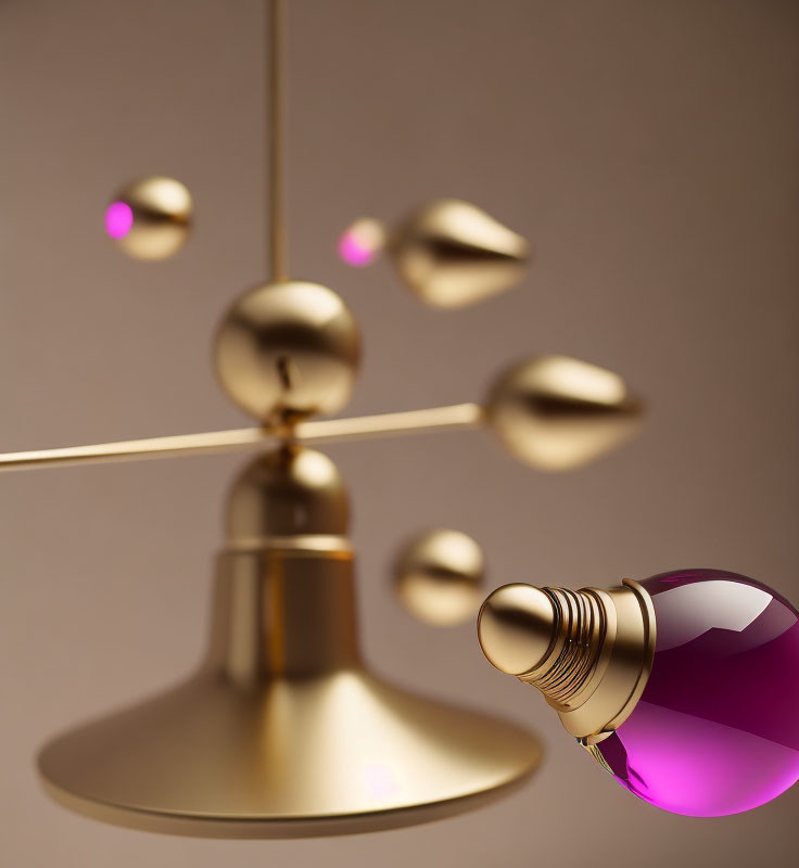 Sleek golden pendant light with purple-tinted bulbs on beige background