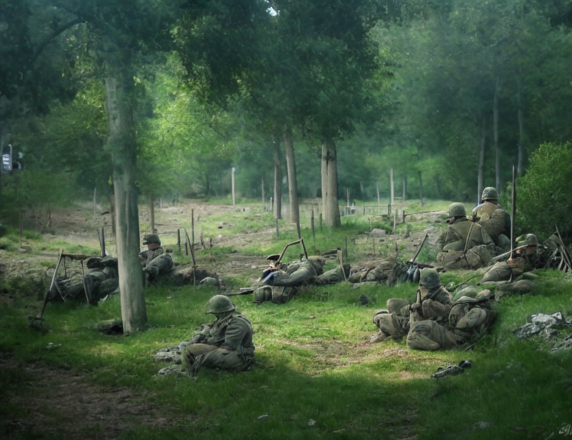 Camouflaged soldiers with weapons in forested environment