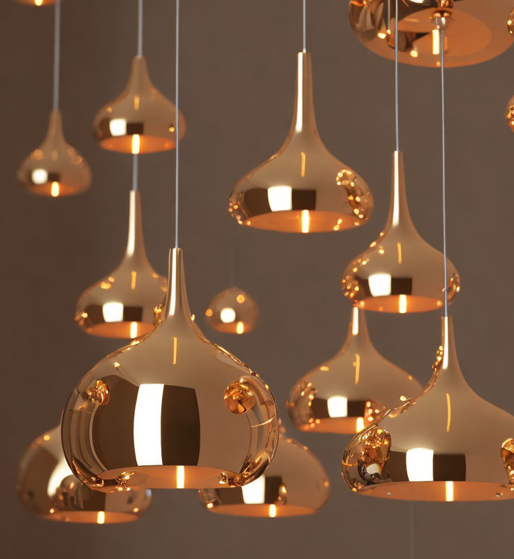 Reflective Gold Pendant Lights on Gray Background for Luxurious Ambiance