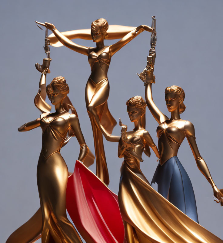 Three golden female statues with swords in dynamic poses on gray background