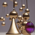 Golden ornaments and baubles in varying heights, one with purple hue and star design