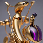 Golden stylized robot with spherical violet eye and intricate joints