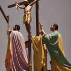 Biblical attire actors reenact crucifixion under clear sky