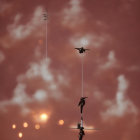 Three street lamps under cloudy reddish sky with bokeh lights, one with birds perched.