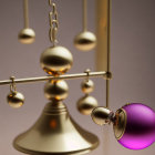 Purple to Gold Gradient Newton's Cradle with Broken Sphere Revealing Diamond Ring