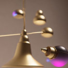 Sleek Metallic Pendant Lights with Purple Accents on Varied Heights