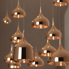 Sleek Copper Pendant Lights with Organic Shape on Neutral Background