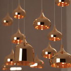 Reflective Copper Finish Pendant Lights Illuminate with Warm Glow