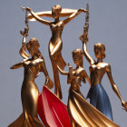 Four Golden Female Figure Statues Holding Trumpets on Gradient Background