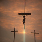 Silhouetted crosses against orange sky with central figure.