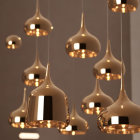 Metallic Finish Pendant Lights Illuminate Dimly Lit Room