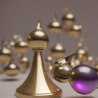 Shiny golden bishop chess piece with orbs and purple sphere on beige background