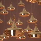 Glossy Modern Gold Pendant Lights Casting Warm Ambient Glow