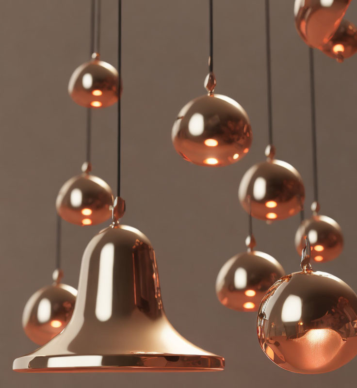 Copper Pendant Lights with Bell and Spherical Ornaments on Neutral Background