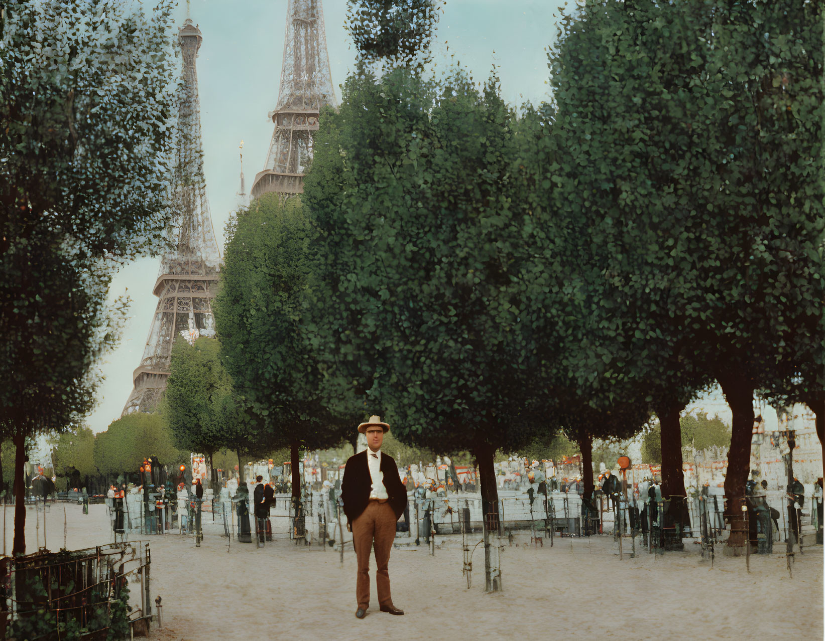 Vintage-dressed man on pathway with Eiffel Tower and people.