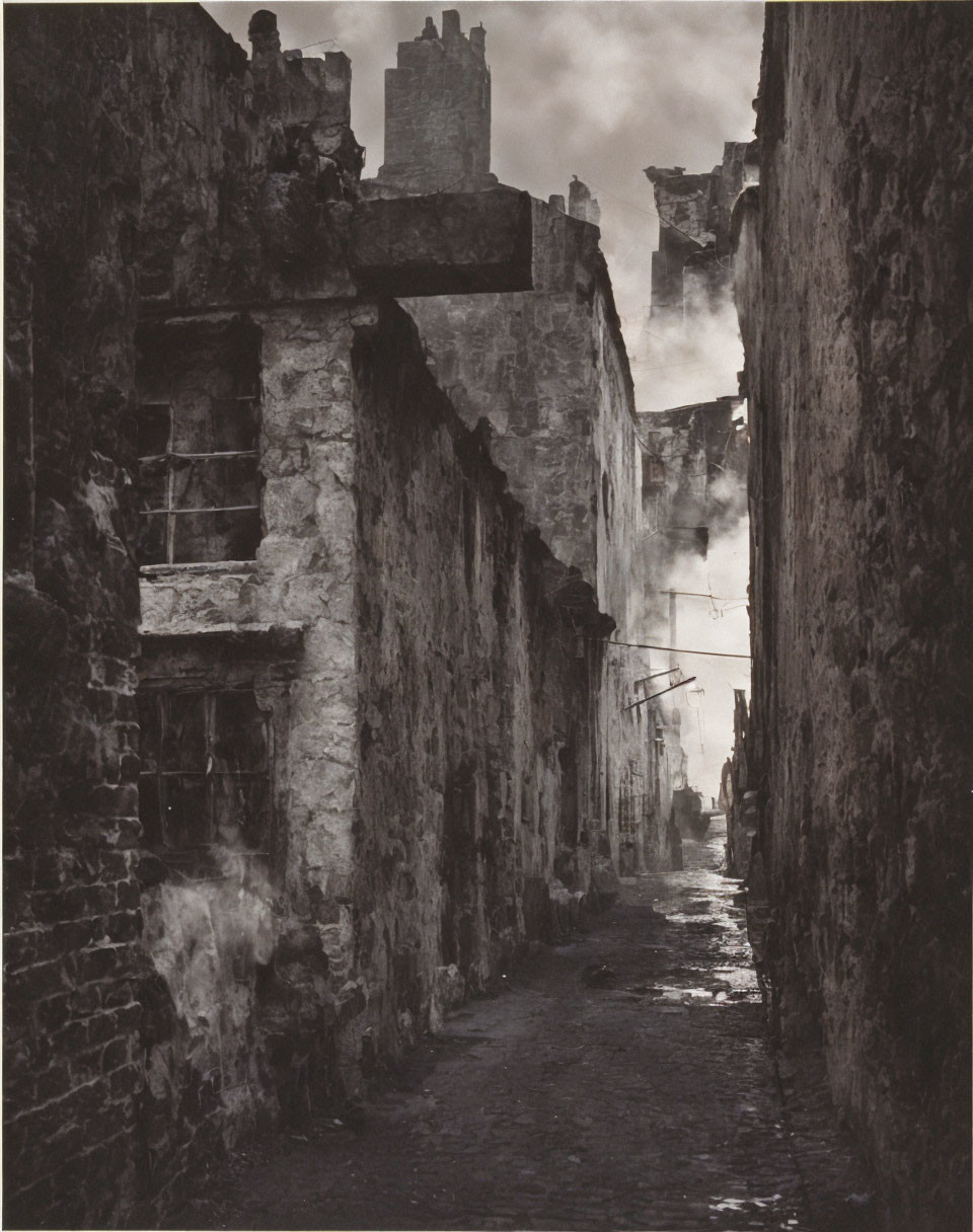 Misty cobblestoned alley with silhouetted figure