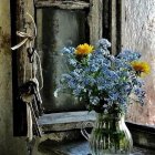 Stained glass window with vase, blue and gold flowers, greenery & patterns