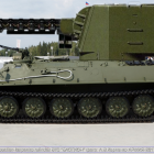 Military tank with main gun left, in snowy outdoor display.