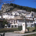 Traditional white houses with terracotta roofs in autumnal village scenery