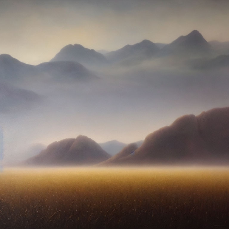 Tranquil landscape with hazy mountain silhouettes and glowing field