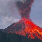 Fiery-red mountain in vibrant landscape at sunset