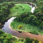 Lush Green Landscape with Rivers and Waterfalls