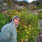 Person in Floral Headscarf in Vibrant Flower Field