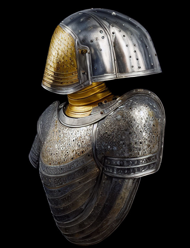 Medieval armor set with golden visor and ornate breastplate on black background