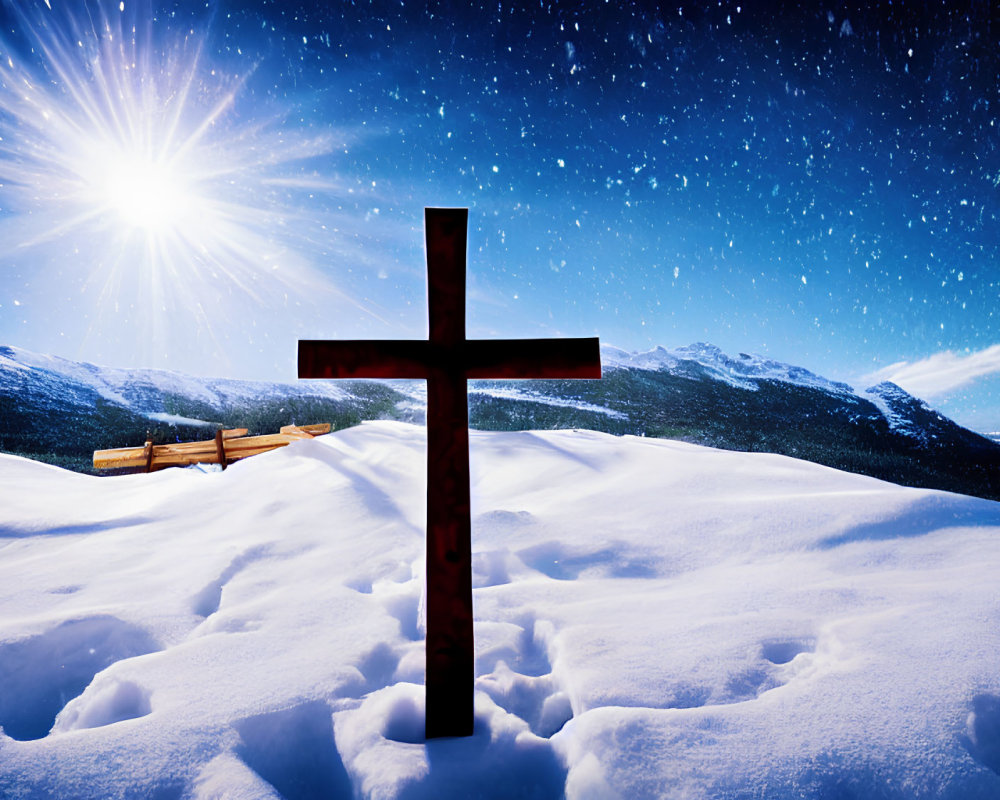 Wooden cross in snowy mountain landscape under starry sky