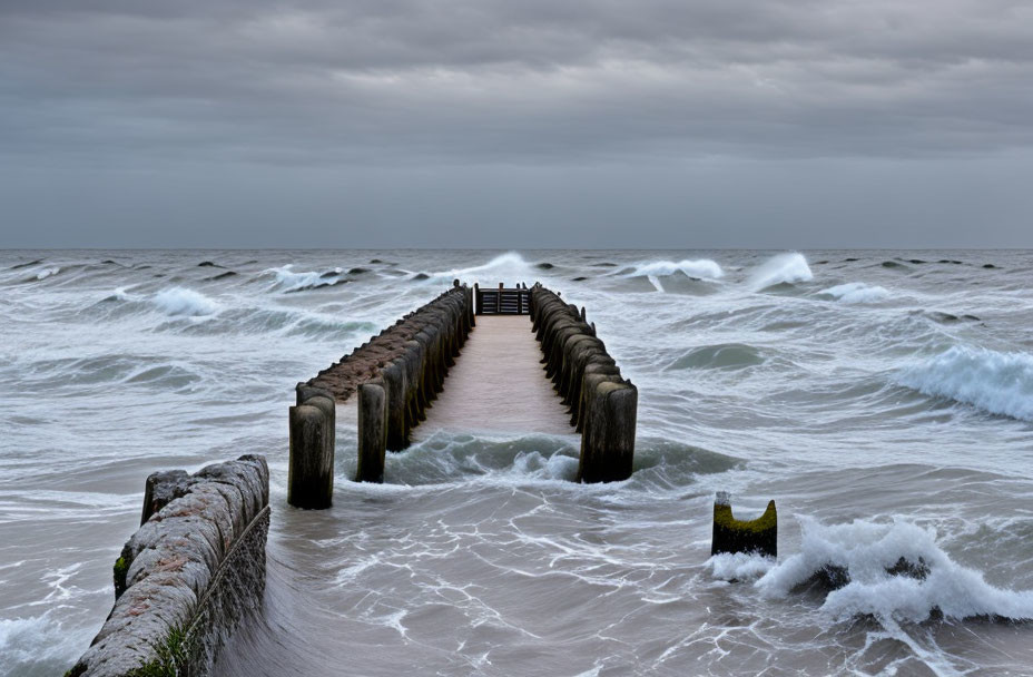 Wooden Pier with Concrete Pillars Extending into Rough Sea