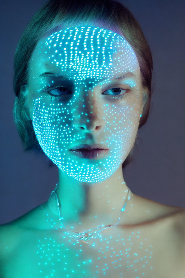 Woman with Dot Pattern Projection on Face and Neck in Ethereal Glow