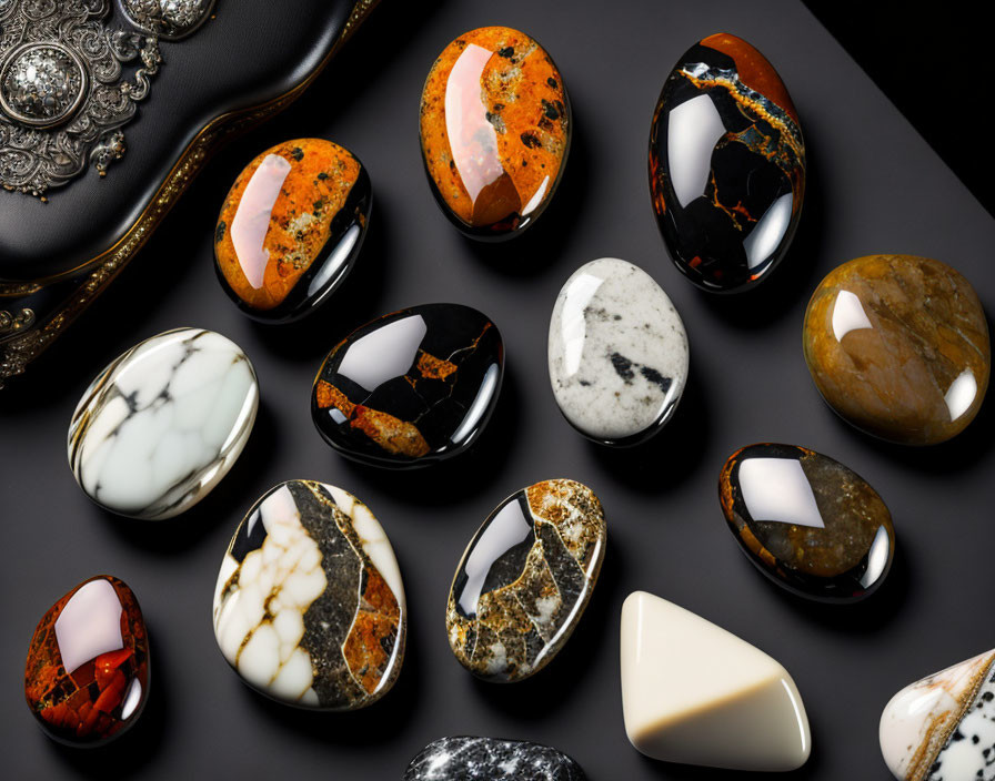 Polished Semiprecious Stones with Intricate Patterns on Dark Surface