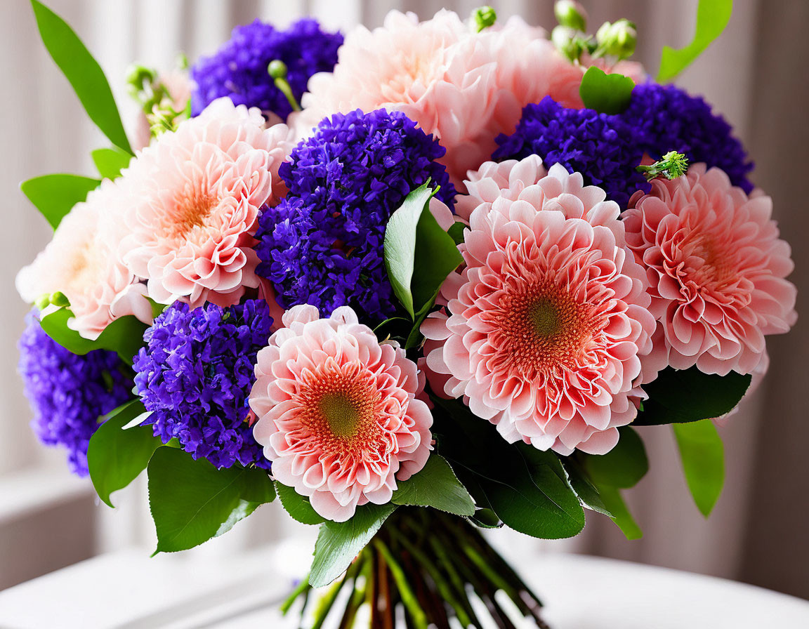 Colorful Pink Dahlias and Purple Hydrangeas Bouquet on Light Background