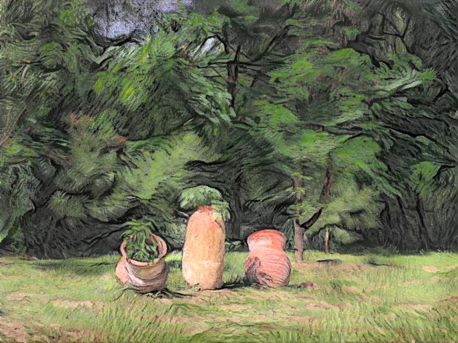 Three flower pots on the grass