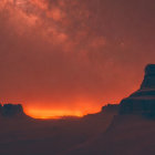 Stunning Milky Way over silhouetted mountain peaks at night