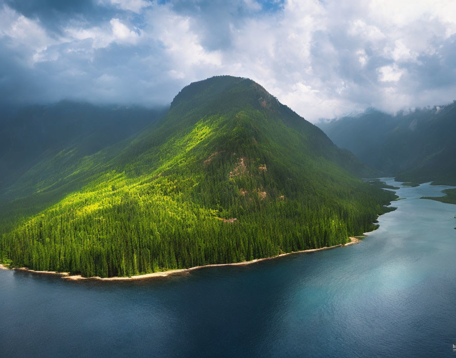 Scenic forested mountain peninsula by serene lake under dramatic sky