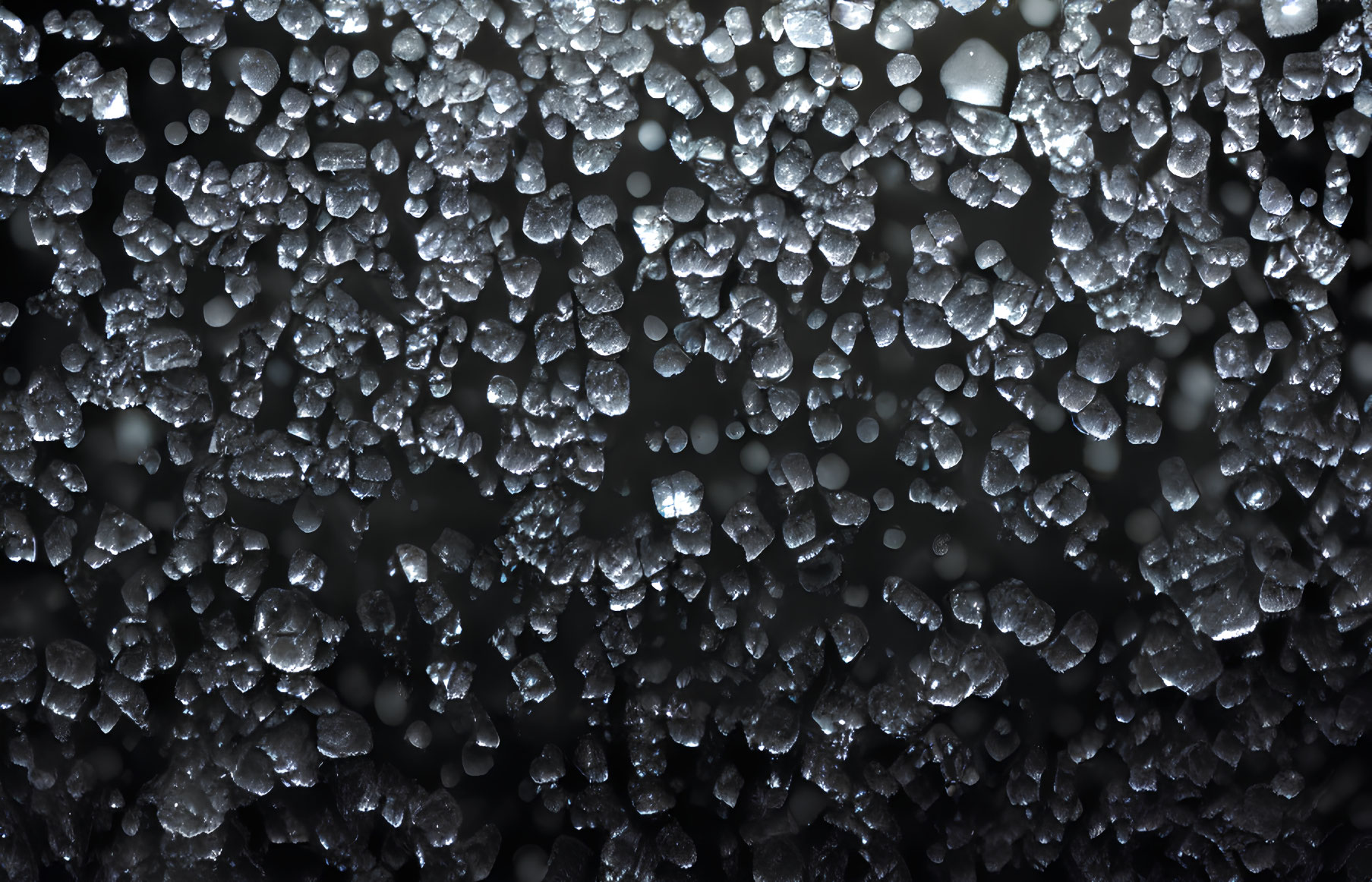 Frozen Water Droplets on Dark Background: Abstract and Dynamic Texture