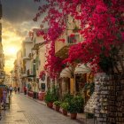 Colorful night scene: radiant trees and shimmering reflections on wet cobblestones