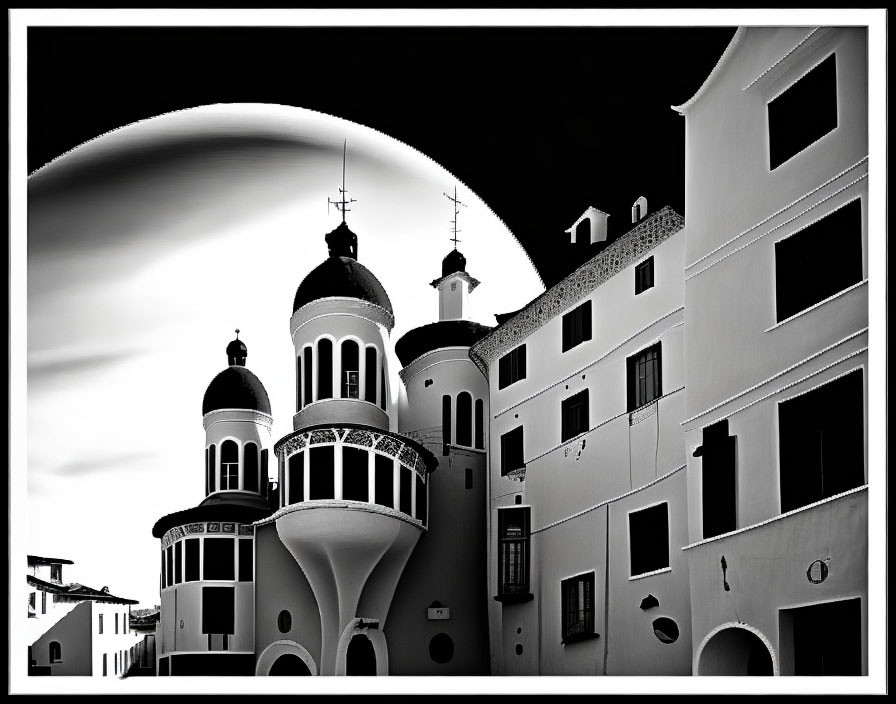 Monochrome image: Mediterranean-style buildings with domes under moonlit sky