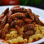 Spaghetti with Tomato Sauce, Seafood, and Fresh Herbs on Plate