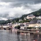 Scenic village with colorful houses by calm river