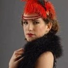 Colorful feather accessory woman portrait with dramatic makeup