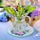 Vintage Ceramic Jug with Floral Design and White Lily of the Valley Bouquet on Plate