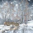 Winter stone bridge over stream in serene snowfall