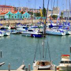 Vibrant marina scene with boats and colorful buildings