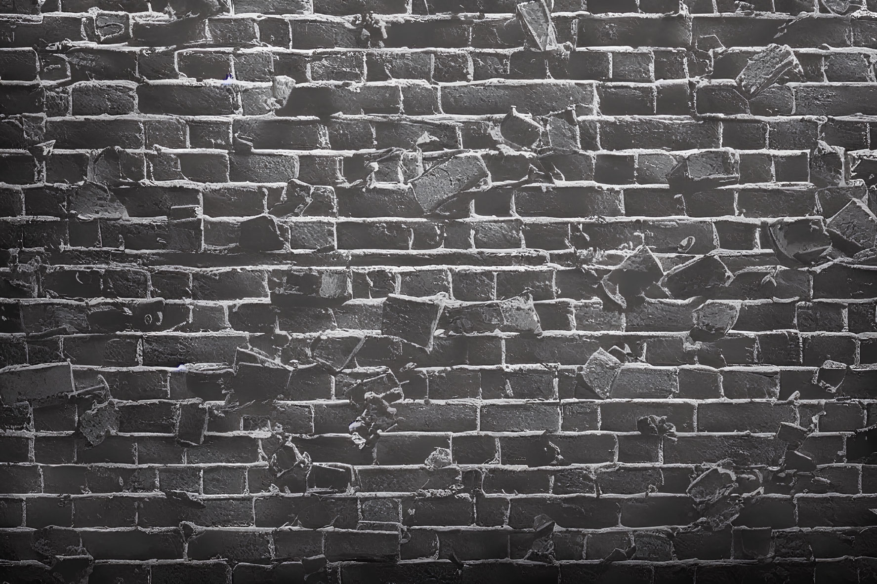 Textured black brick wall with varying shades and signs of wear