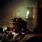 Cherries, whipped cream, and glass on table with fabric