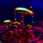 Colorful 3D fractal landscape with mushroom structures and floating clouds