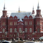 Ornate brown and gold fantasy structure with domes and spires against blue sky