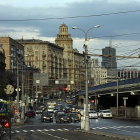 Colorful Retro Cars and Pedestrians in Vibrant Street Scene